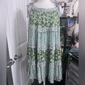Pretty ruffled and tiered sundress with tie straps. NWOT